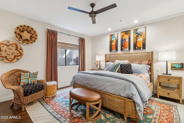 bedroom featuring wood-type flooring, ceiling fan, and ornamental molding