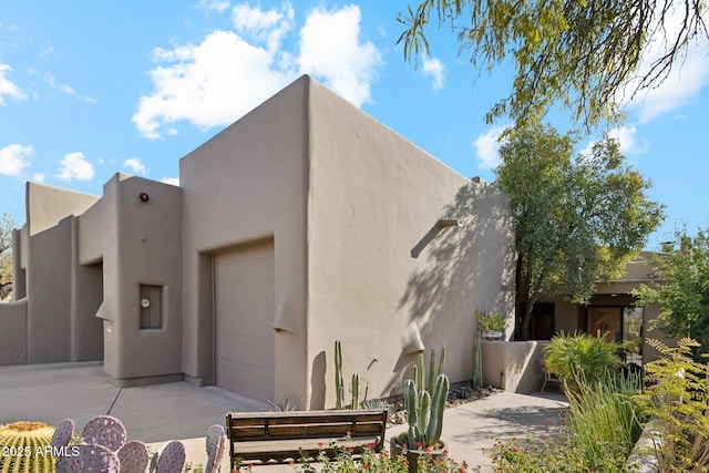 view of property exterior with a garage