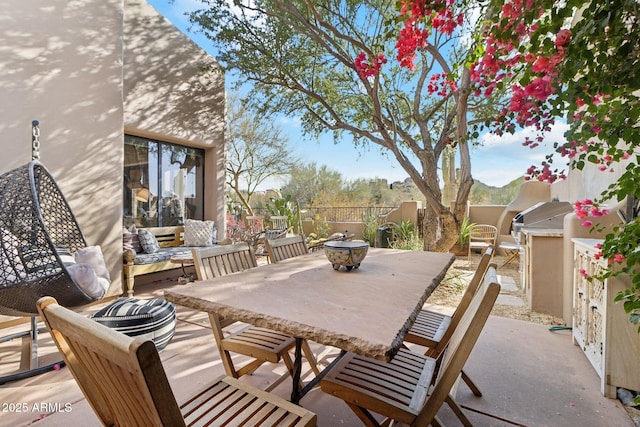 view of patio featuring a grill