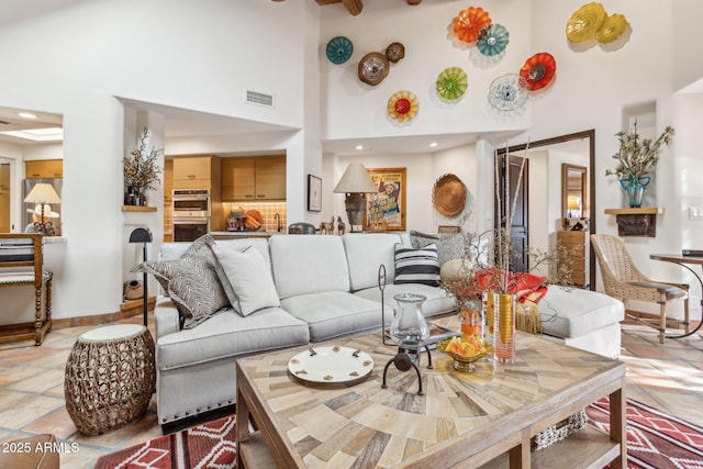 living room with a high ceiling