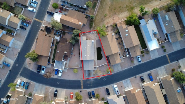 birds eye view of property with a residential view