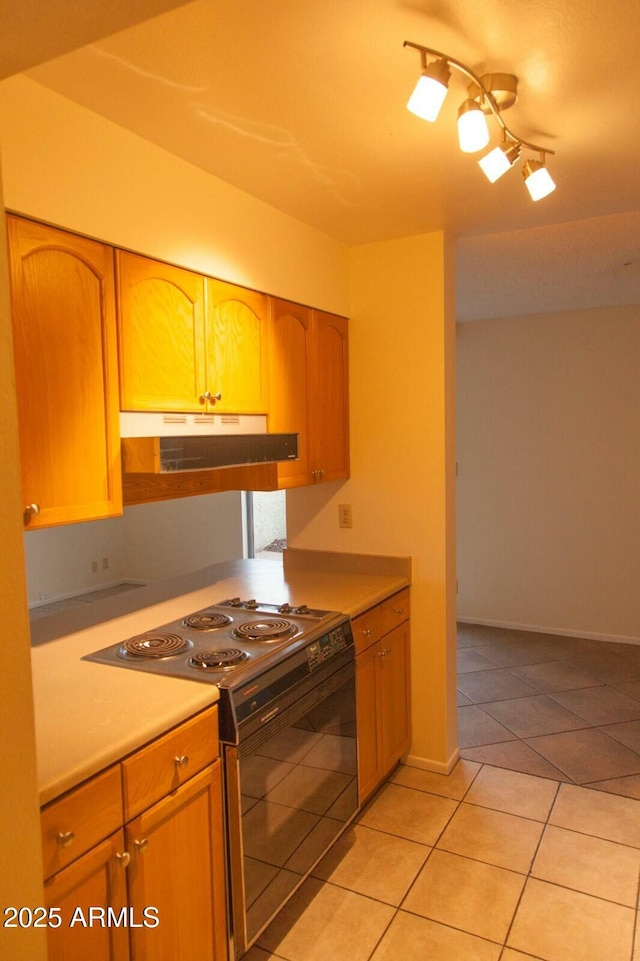 kitchen with range with electric stovetop and light tile patterned floors