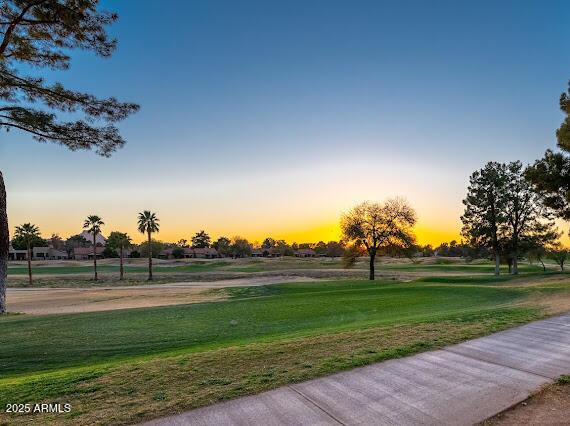 surrounding community featuring a lawn