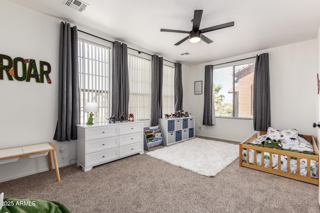 bedroom featuring a ceiling fan, carpet, visible vents, and baseboards