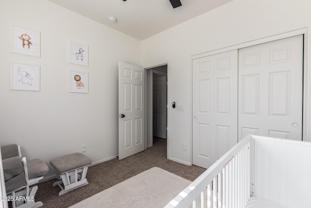 bedroom with dark colored carpet, a closet, a ceiling fan, and baseboards