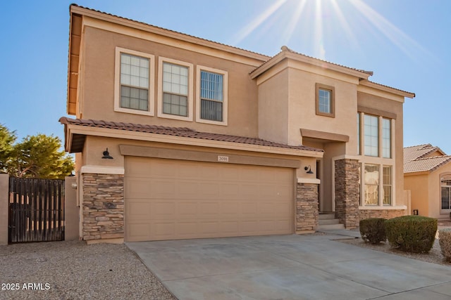 view of front of home with an attached garage, stone siding, driveway, and stucco siding