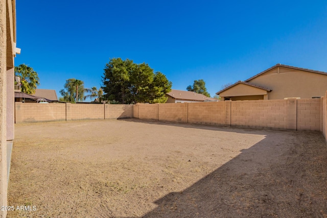 view of yard featuring a fenced backyard