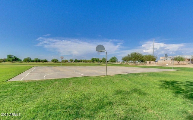 view of sport court with community basketball court and a lawn