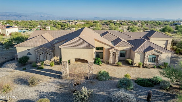 view of front of home featuring a mountain view