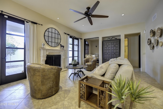 living room with light tile patterned flooring and ceiling fan