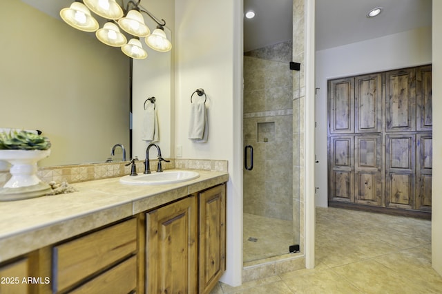 bathroom featuring vanity, an enclosed shower, and tile patterned floors