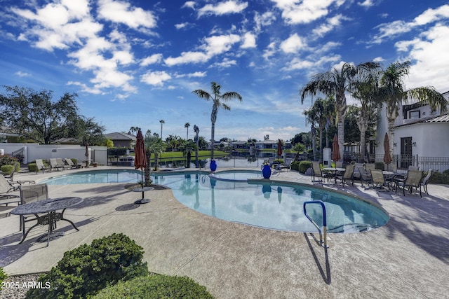 view of swimming pool with a patio