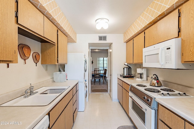 kitchen featuring sink and white appliances