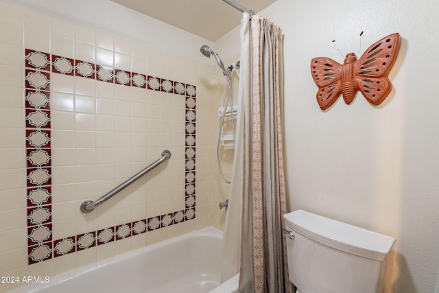 bathroom featuring toilet and shower / bath combo