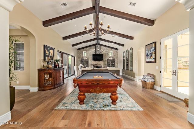 rec room with hardwood / wood-style flooring, a chandelier, billiards, and french doors