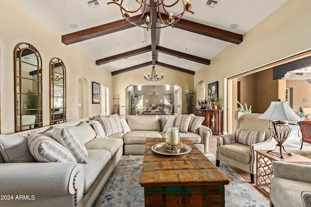 living room with a chandelier and vaulted ceiling with beams