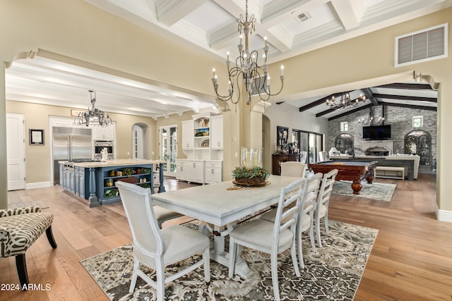 dining room featuring a large fireplace, light hardwood / wood-style floors, pool table, and beamed ceiling