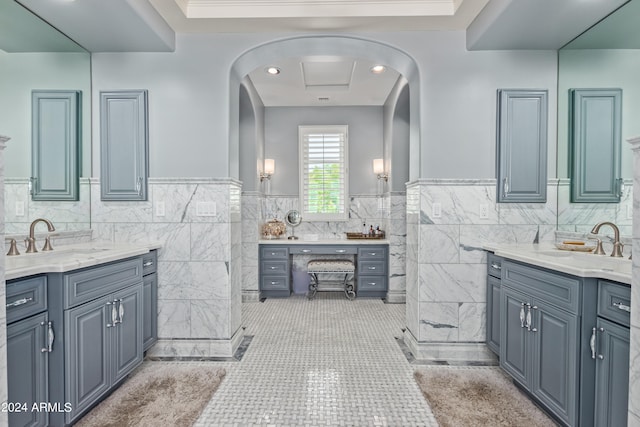 bathroom with tile walls, tile patterned floors, and vanity