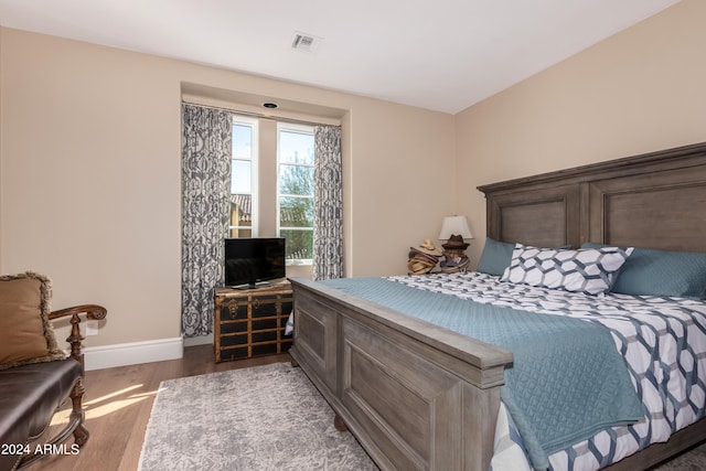 bedroom with wood-type flooring