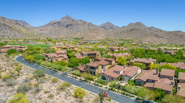 birds eye view of property with a mountain view