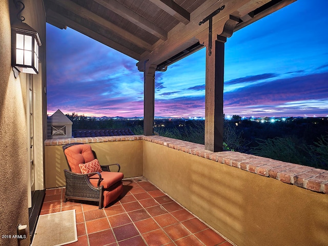 view of balcony at dusk