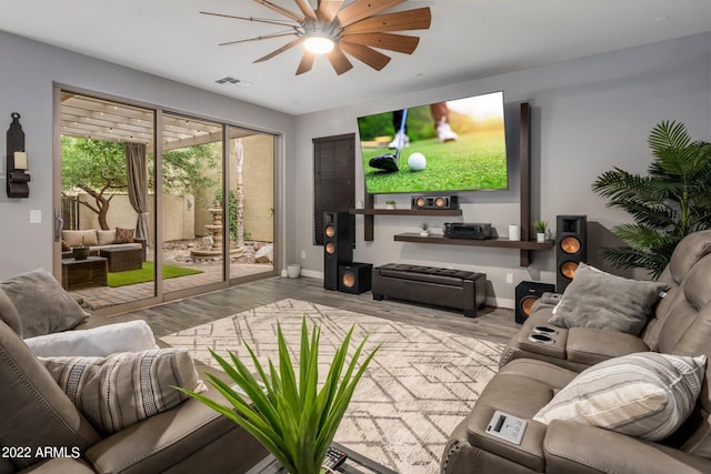 living room featuring ceiling fan, visible vents, baseboards, and wood finished floors