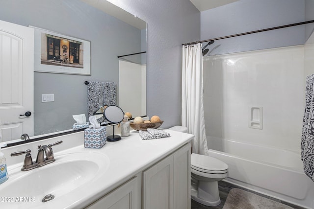 bathroom featuring vanity, toilet, and shower / bath combo