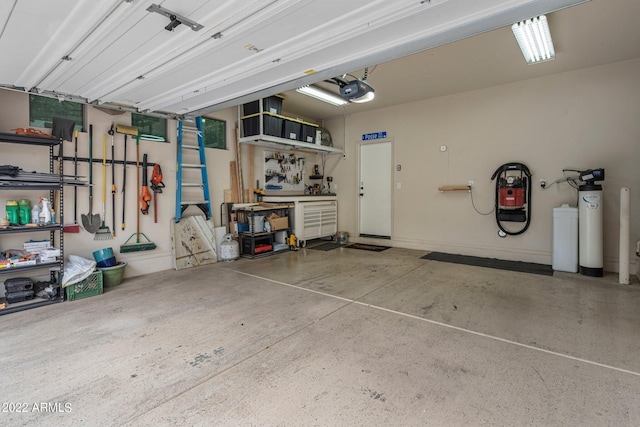 garage featuring a workshop area and a garage door opener