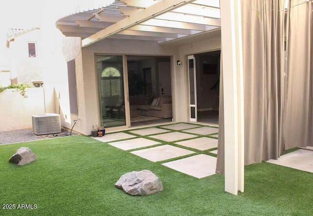 exterior space featuring central air condition unit and a pergola