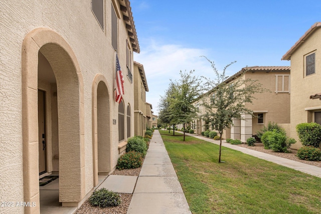 surrounding community featuring a yard