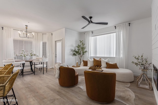 5401 E Van Buren St Unit 1088, Phoenix, AZ 85008 - living room with a chandelier, wood finished floors, and ceiling fan