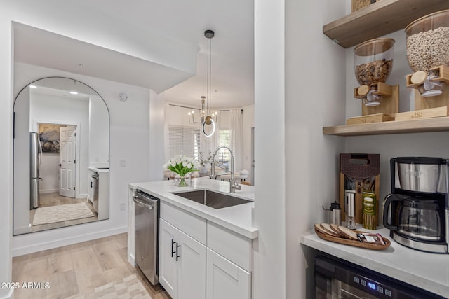 5401 E Van Buren St Unit 1088, Phoenix, AZ 85008 - kitchen with white cabinets, light countertops, appliances with stainless steel finishes, pendant lighting, and open shelves