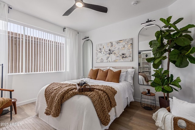 5401 E Van Buren St Unit 1088, Phoenix, AZ 85008 - bedroom featuring wood finished floors and a ceiling fan