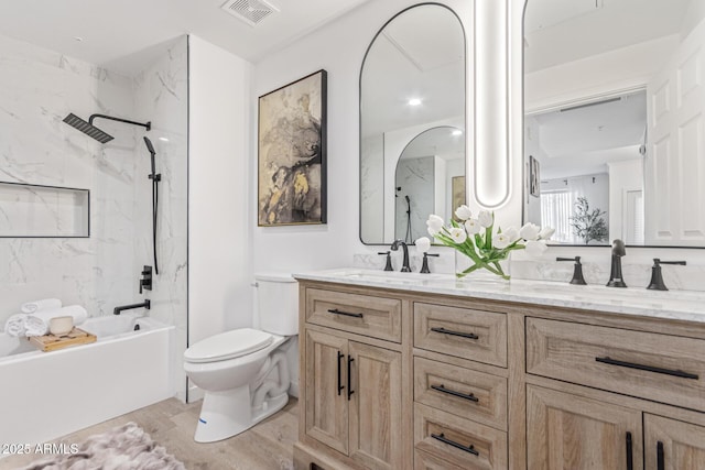 5401 E Van Buren St Unit 1088, Phoenix, AZ 85008 - bathroom featuring double vanity, wood finished floors, and shower / bathtub combination