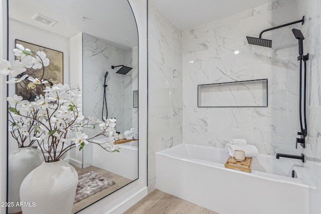 5401 E Van Buren St Unit 1088, Phoenix, AZ 85008 - full bathroom featuring a marble finish shower, a tub, and wood finished floors