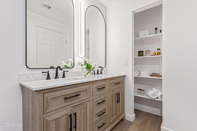 5401 E Van Buren St Unit 1088, Phoenix, AZ 85008 - full bathroom with double vanity and wood finished floors