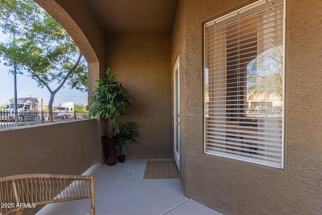 5401 E Van Buren St Unit 1088, Phoenix, AZ 85008 - property entrance with stucco siding and a balcony