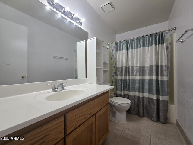 full bathroom with tile patterned flooring, vanity, toilet, and shower / bath combo with shower curtain