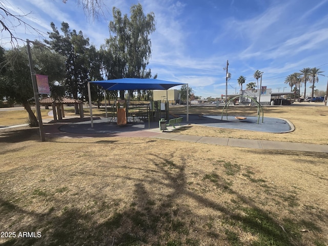 view of community featuring a lawn and a playground