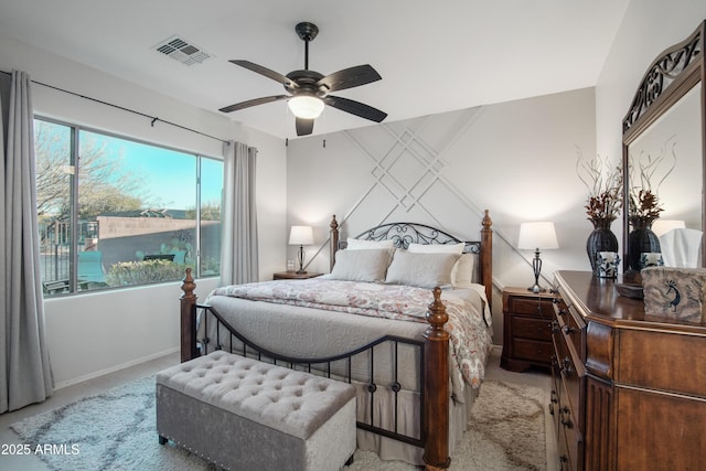 bedroom featuring ceiling fan and light colored carpet