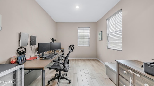office with light wood-style floors, baseboards, and beverage cooler