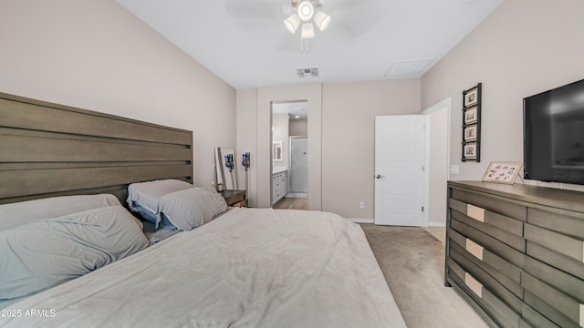 bedroom with light carpet, baseboards, ensuite bath, and a ceiling fan