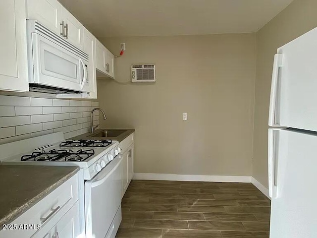 1620 E Palm Ln, Phoenix, AZ 85006 - kitchen featuring white appliances, a sink, a wall mounted AC, wood tiled floors, and white cabinets