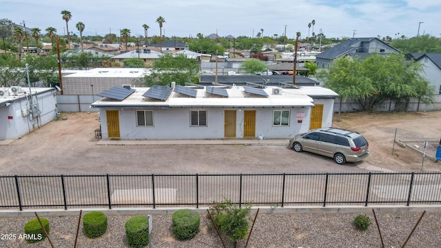 1620 E Palm Ln, Phoenix, AZ 85006 - view of front of property featuring a fenced backyard, a residential view, solar panels, and brick siding