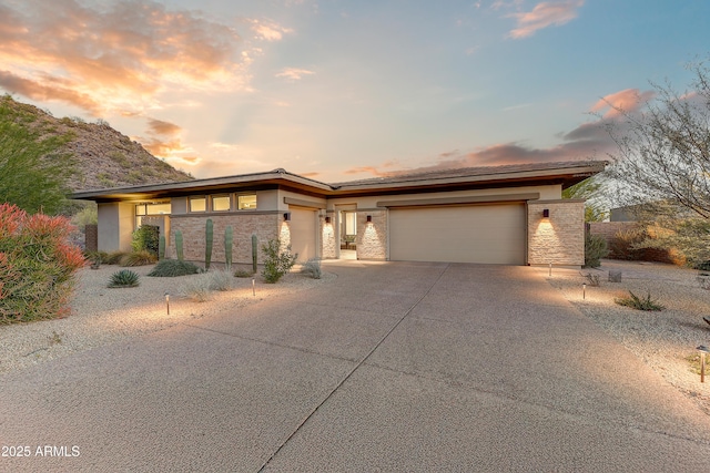 prairie-style home featuring a garage