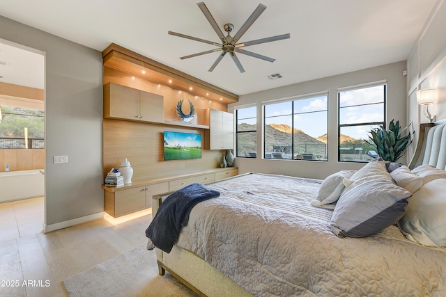 bedroom with light hardwood / wood-style flooring and ceiling fan