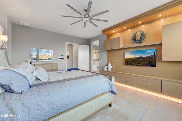 bedroom with ceiling fan and light hardwood / wood-style floors