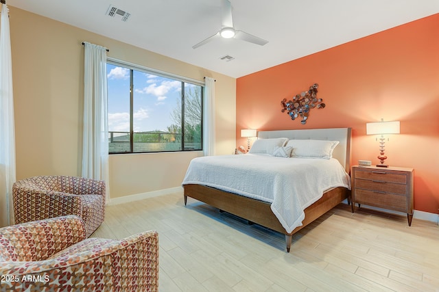 bedroom featuring ceiling fan and light hardwood / wood-style floors