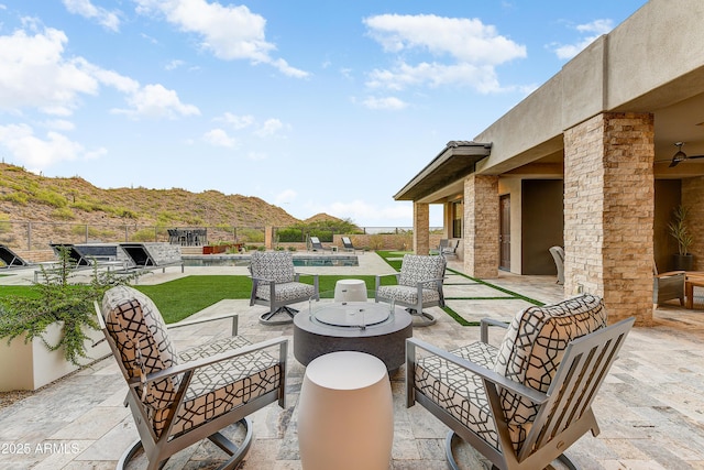 view of patio featuring a mountain view and a swimming pool