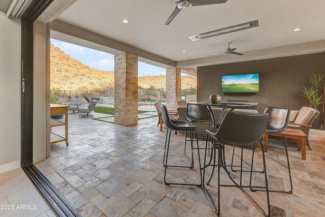 view of patio / terrace featuring ceiling fan